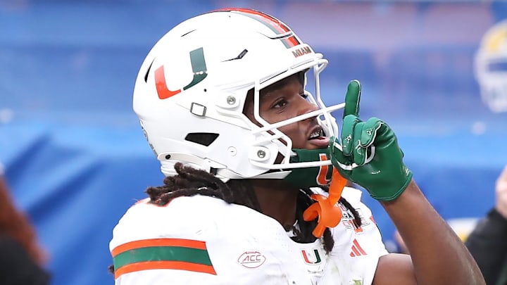 Nov 29, 2025; Pittsburgh, Pennsylvania, USA;  Miami Hurricanes wide receiver Malachi Toney (10) reacts after catching a touchdown pass against the Pittsburgh Panthers during the second quarter at Acrisure Stadium. Mandatory Credit: Charles LeClaire-Imagn Images