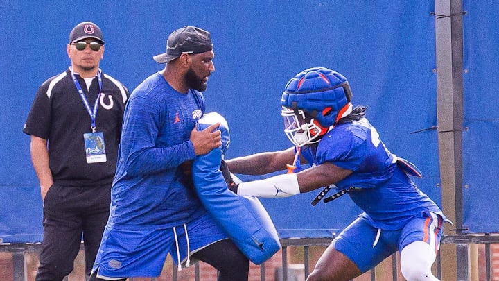New Florida secondary coach Will Harris runs a drill with one of his defensive backs during the Florida Gators as they held their final open Spring football practice before the Orange and Blue Game at Sanders Practice Fields in Gainesville, FL on Tuesday, April 9, 2024. [Doug Engle/Gainesville Sun]