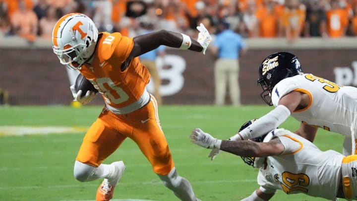 Tennessee wide receiver Mike Matthews (10) breaks free from Kent State defensive back Jaylen Dotson (19) and linebacker Jayden Studio (32) after making a catch during their NCAA college football game on Saturday, September 14, 2024, in Knoxville, Tenn.