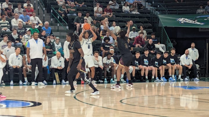 Tulane forward Tyler Ringgold Looks to Pass against Texas State