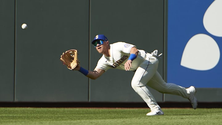 Seattle Mariners left fielder Jake Bauers (5) catches the ball for an out during the ninth inning against the Kansas City Royals at T-Mobile Park in 2021. Seattle Mariners left fielder Jake Bauers (5) catches the ball for an out during the ninth inning against the Kansas City Royals at T-Mobile Park in 2021.