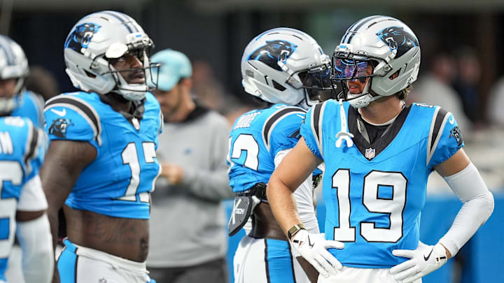 Aug 2, 2025; Charlottle, NC, USA; Carolina Panthers wide receiver Xavier Legette (17) chats with wide receiver Adam Thielen (19) during Fanfest at Bank of America Stadium.