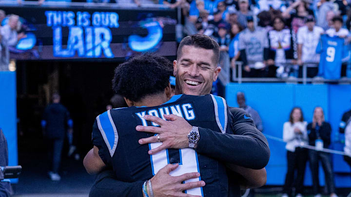Nov 3, 2024; Charlotte, North Carolina, USA; Carolina Panthers head coach Dave Canales hugs quarterback Bryce Young (9) after getting the win against the New Orleans Saints at Bank of America Stadium. Nov 3, 2024; Charlotte, North Carolina, USA; Carolina Panthers head coach Dave Canales hugs quarterback Bryce Young (9) after getting the win against the New Orleans Saints at Bank of America Stadium.