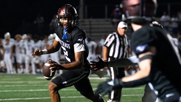Lipscomb's Deuce Knight (2) looks upfield against IMG at Lipscomb's Reese Smith Football Field in Nashville, Tenn., Friday night, Aug. 18, 2023. IMG went on to win the game 35-10.