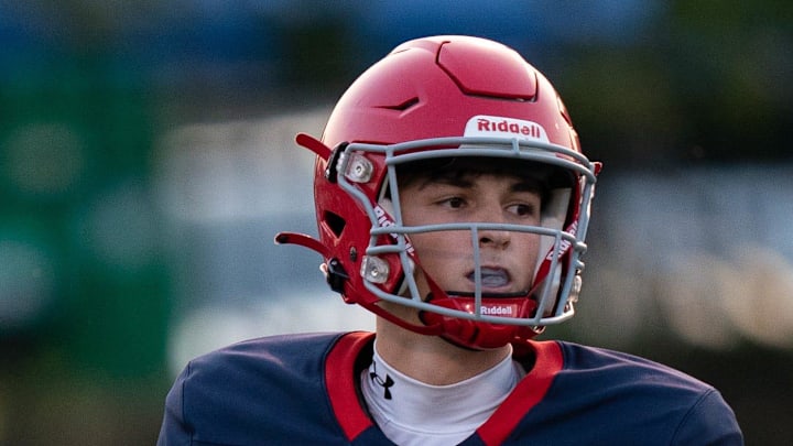 Brentwood Academy's George MacIntyre (12) drops back to pass against CPA at Brentwood Academy in Nashville, Tenn., Saturday night, Aug. 19, 2023.