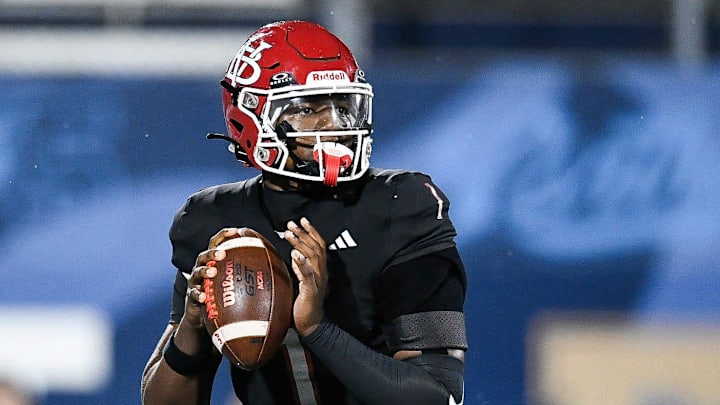 Champ Monds (1) of Vero Beach looks to pass in the FHSAA Class 7A state championship, Dec. 13, 2025, at Pitbull Stadium in Miami. Champ Monds (1) of Vero Beach looks to pass in the FHSAA Class 7A state championship, Dec. 13, 2025, at Pitbull Stadium in Miami.