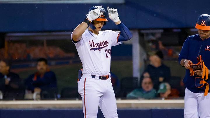 Virginia Cavaliers outfielder AJ Gracia (29) earns a walk, celebrating with the buffalo sign towards his teammates. Virginia Cavaliers outfielder AJ Gracia (29) earns a walk, celebrating with the buffalo sign towards his teammates.