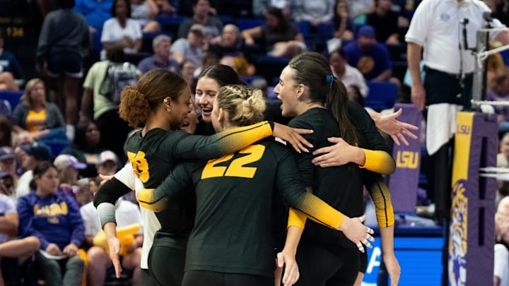 Missouri Tigers volleyball players celebrate together during the team's win over LSU.