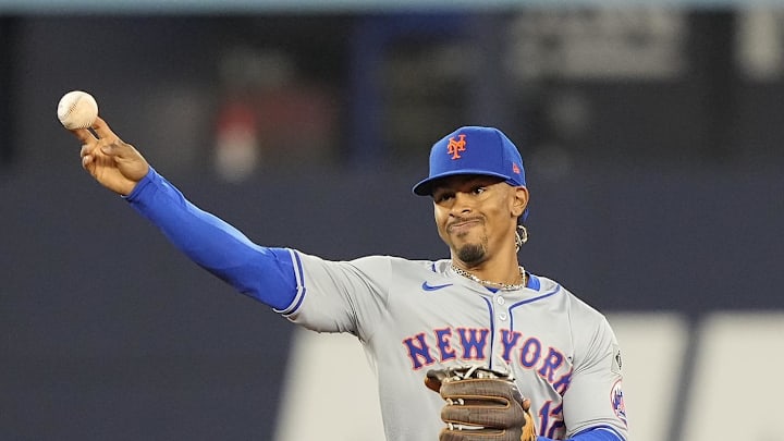 Sep 9, 2024; Toronto, Ontario, CAN; New York Mets shortstop Francisco Lindor (12) throws to first for an out during the sixth inning against the Toronto Blue Jays at Rogers Centre. Mandatory Credit: John E. Sokolowski-Imagn Images
