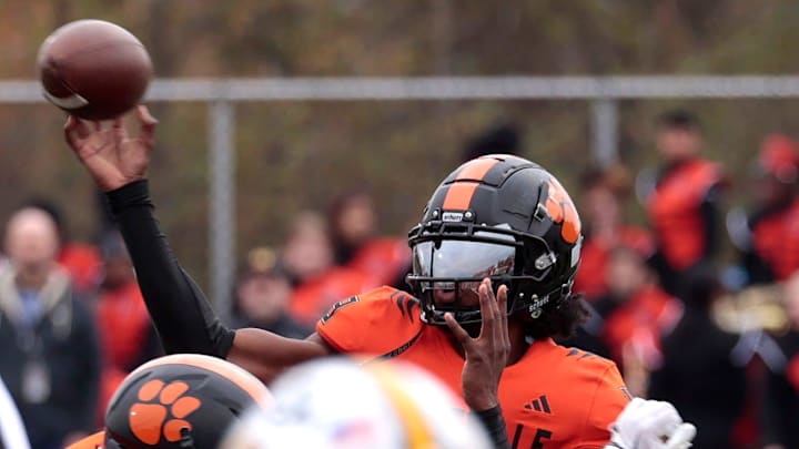 Belleville quarterback Bryce Underwood throws downfield during first-half action in the MHSAA