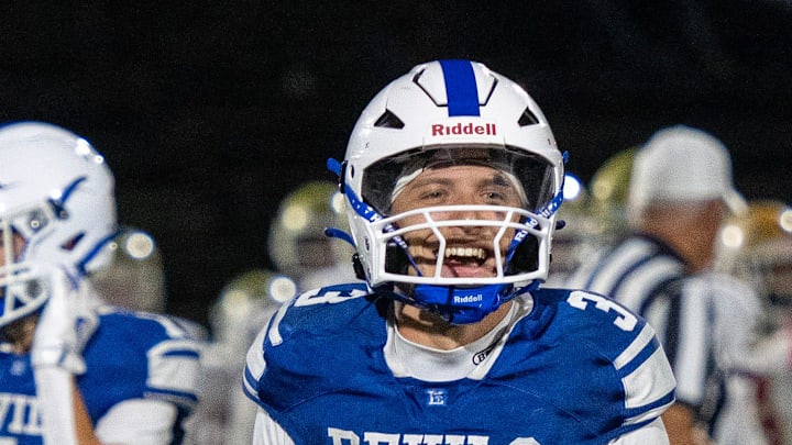 Leominster quarterback Osiris Lopez celebrates a win over against Doherty at Doyle Field Friday.