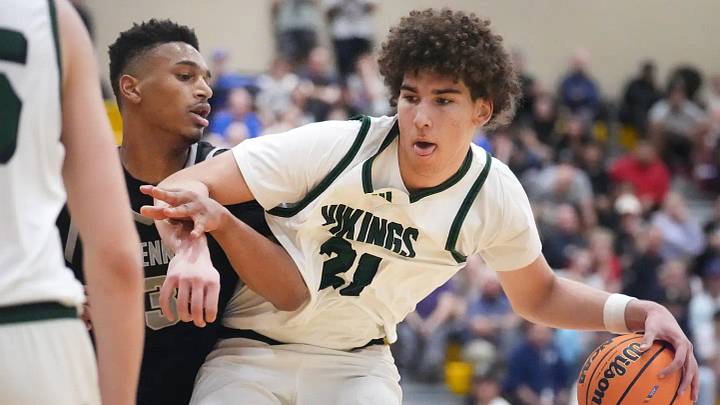 Millennium Tigers guard Cameron Holmes (3) defends Sunnyslope Vikings Darius Wabbington (21) Millennium Tigers guard Cameron Holmes (3) defends Sunnyslope Vikings Darius Wabbington (21)