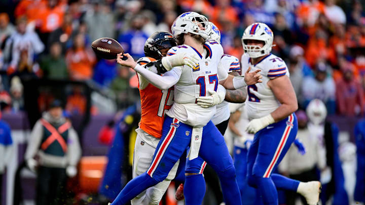 DENVER, CO - JANUARY 17: Buffalo Bills quarterback Josh Allen (17) is sacked by Denver Broncos linebacker Nik Bonitto (15) as he fumbles the ball in the third quarter in the AFC Divisional Round game at Empower Field at Mile High on January 17, 2026 in Denver, Colorado. 