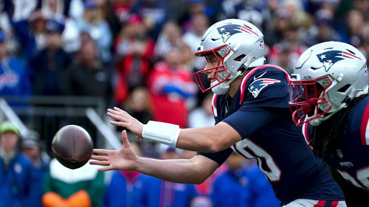 Mac Jones takes a snap in the final seconds of the Patoit's 29-25 win over the Bills.