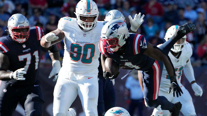 New England running back Antonio Gibson is tripped up and sent flying by Miami defender Marcus Maye in the 4th quarter. New England running back Antonio Gibson is tripped up and sent flying by Miami defender Marcus Maye in the 4th quarter.