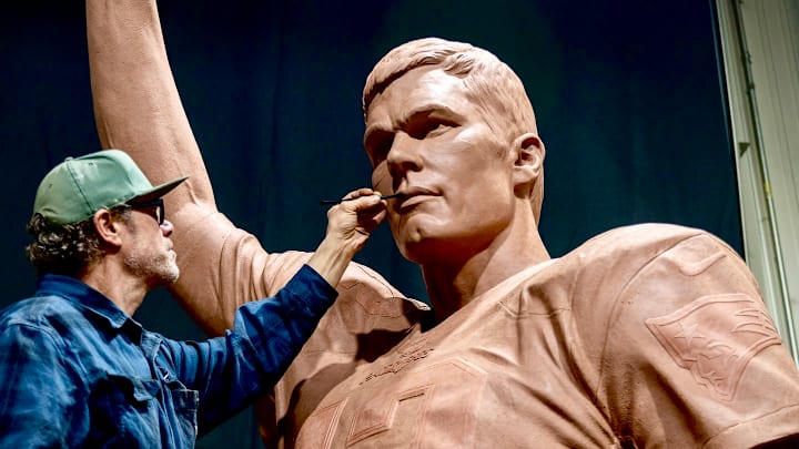 Master sculptor Jeff Buccacio works on the face of New England Patriots Hall of Fame quarterback Tom Brady's 17-foot statue. Master sculptor Jeff Buccacio works on the face of New England Patriots Hall of Fame quarterback Tom Brady's 17-foot statue.
