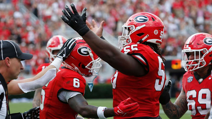 Georgia wide receiver Colbie Young (8) celebrates with Georgia offensive lineman Jared Wilson (55) after scoring touchdown during the first half of a NCAA college football game against Tennessee Tech in Athens, on Saturday, Sept. 7, 2024. | 