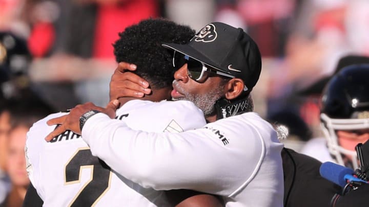 Colorado football coach Deion Sanders hugs his son, Shedeur Sanders, before facing Texas Tech. Colorado football coach Deion Sanders hugs his son, Shedeur Sanders, before facing Texas Tech.