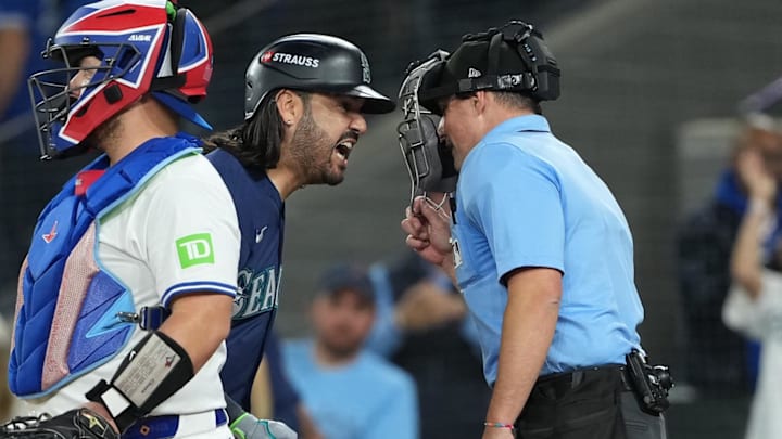 Oct 20, 2025; Toronto, Ontario, CAN; Seattle Mariners third baseman Eugenio Suarez (28) argues a called third strike with home plate umpire Quinn Wolcott in the eighth inning against the Toronto Blue Jays during game seven of the ALCS round for the 2025 MLB playoffs at Rogers Centre. Mandatory Credit: Nick Turchiaro-Imagn Images Oct 20, 2025; Toronto, Ontario, CAN; Seattle Mariners third baseman Eugenio Suarez (28) argues a called third strike with home plate umpire Quinn Wolcott in the eighth inning against the Toronto Blue Jays during game seven of the ALCS round for the 2025 MLB playoffs at Rogers Centre. Mandatory Credit: Nick Turchiaro-Imagn Images