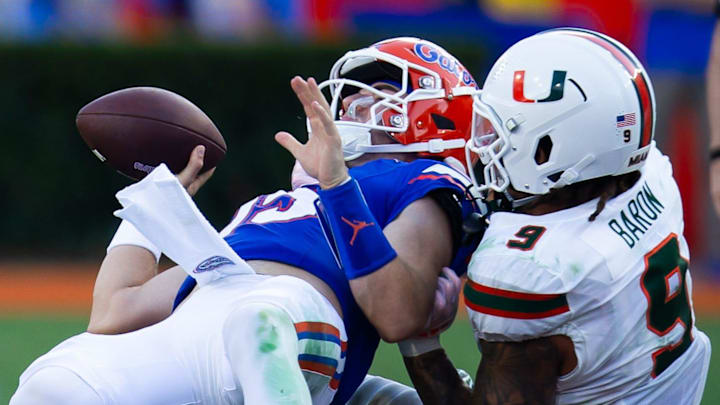 Miami Hurricanes defensive lineman Tyler Baron (9) sacks Florida Gators quarterback Graham Mertz (15) during the season opener at Ben Hill Griffin Stadium in Gainesville, FL on Saturday, August 31, 2024 against the University of Miami Hurricanes in the second half. Miami defeated the Gators 41-17. [Doug Engle/Gainesville Sun]