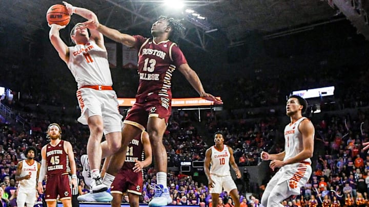 Jan 13, 2024; Clemson, South Carolina, USA; Clemson Tigers guard Joseph Girard III shoots the ball against Boston College Eagles guard Donald Hand (13) during the second half at Littlejohn Coliseum. Mandatory Credit: Ken Ruinard-Imagn Images