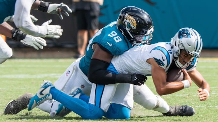 Jaguars defensive end Dawuane Smoot (98) sacks Carolina Panthers quarterback Bryce Young (9) during the third quarter of an NFL football game between the Carolina Panthers at Jacksonville Jaguars at EverBank Stadium Sunday September 7, 2025. Jaguars defeated the Panthers 26-10. 