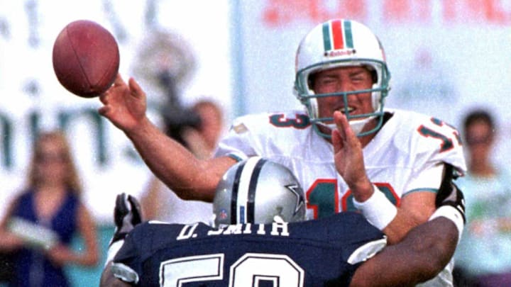 Miami Dolphin quarterback Dan Marino (R) releases