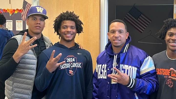 Wassie Lugolobi with UW coaches Taylor Mays and Ryan Walters.