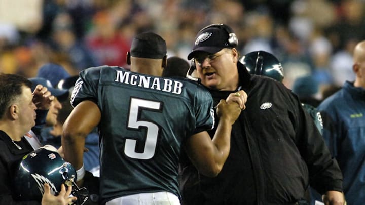 December 15, 2008; Philadelphia, PA USA; Philadelphia Eagles quarterback Donovan McNabb (5) is congratulated from head coach Andy Reid after McNabb threw touchdown pass in fourth quarter of the 30-10 win over the Cleveland Browns at Lincoln Financial Field. Mandatory Credit: Eric Hartline-Imagn Images