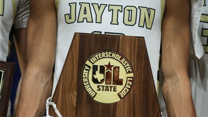 Jayton accepts their championship trophy after the Class 1A Division II state championship boys basketball game on Saturday, March 6, 2025, at the Alamodome in San Antonio, Texas. Jayton defeated Bryson 70-36.