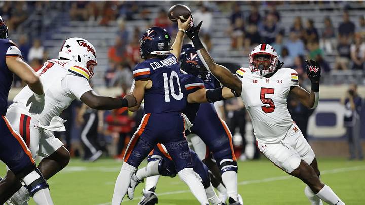 Virginia Cavaliers quarterback Anthony Colandrea (10) attempts to evade the Maryland pass rush Sept. 14, 2024 at Scott Stadium. Virginia Cavaliers quarterback Anthony Colandrea (10) attempts to evade the Maryland pass rush Sept. 14, 2024 at Scott Stadium.