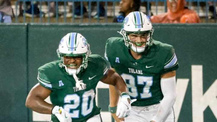 Tulane running back Arnold Barnes III (20) and tight end Alex Bauman (87) celebrate Barnes' touchdown during the second half of an NCAA football game at Yulman Stadium in New Orleans, Saturday, Nov. 9, 2024. Tulane running back Arnold Barnes III (20) and tight end Alex Bauman (87) celebrate Barnes' touchdown during the second half of an NCAA football game at Yulman Stadium in New Orleans, Saturday, Nov. 9, 2024.