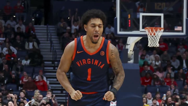 Feb 14, 2026; Nashville, Tennessee, USA;  Virginia Cavaliers guard Malik Thomas (1) reacts after a made three-point basket against the Ohio State Buckeyes during the second half at Bridgestone Arena. Mandatory Credit: Steve Roberts-Imagn Images