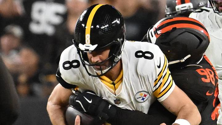 Cleveland Browns defensive end Adin Huntington, Pittsburgh Steelers quarterback Aaron Rodgers Cleveland Browns defensive end Adin Huntington, Pittsburgh Steelers quarterback Aaron Rodgers