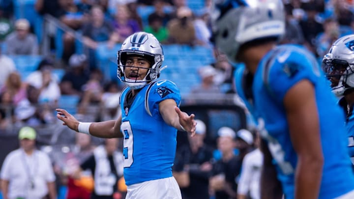 Aug 8, 2025; Charlotte, North Carolina, USA; Carolina Panthers quarterback Bryce Young (9) checks the play during the second quarter against the Cleveland Browns at Bank of America Stadium.