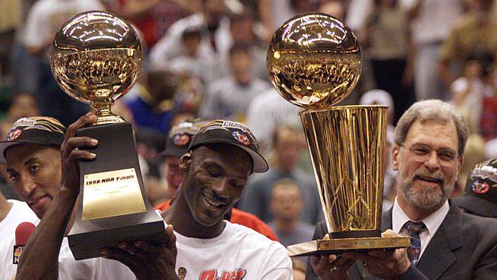 June 14, 1998; Salt Lake City, UT, USA; Chicago Bulls guard Michael Jordan holds the MVP trophy and coach Phil Jackson holds the championship trophy after the Bulls beat the Utah Jazz to win their 6th NBA title. Mandatory Credit: Robert Hanashiro-USA TODAY June 14, 1998; Salt Lake City, UT, USA; Chicago Bulls guard Michael Jordan holds the MVP trophy and coach Phil Jackson holds the championship trophy after the Bulls beat the Utah Jazz to win their 6th NBA title. Mandatory Credit: Robert Hanashiro-USA TODAY