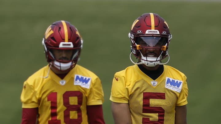 Washington Commanders quarterback Jayden Daniels and Commanders quarterback Marcus Mariota.