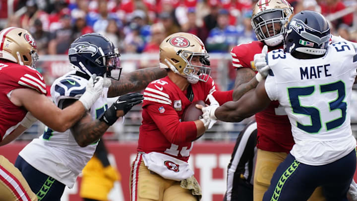 Nov 17, 2024; Santa Clara, California, USA; Seattle Seahawks defensive end Dre'Mont Jones (55) sacks San Francisco 49ers quarterback Brock Purdy (13) in the second quarter at Levi's Stadium. 