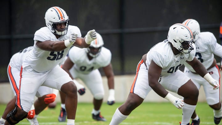 Auburn Tigers defensive line runs through drills during Auburn Tigers football practice at the Woltosz Football Performance Center at in Auburn, Ala., on Monday, April 3, 2023.