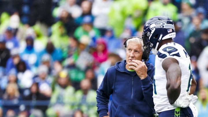 Sep 24, 2023; Seattle, Washington, USA; Seattle Seahawks head coach Pete Carroll talks with wide receiver DK Metcalf (14) during a third quarter timeout against the Carolina Panthers at Lumen Field.