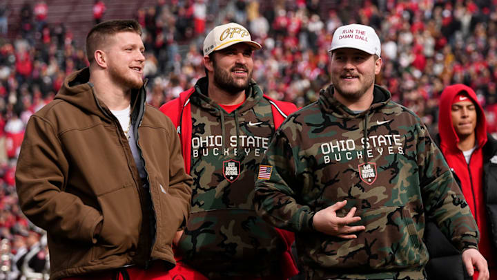 From left, Ohio State Buckeyes defensive end Jack Sawyer, offensive lineman Josh Fryar and offensive lineman Seth McLaughlin arrive for the Ohio State Buckeyes College Football Playoff National Championship celebration at Ohio Stadium in Columbus on Jan. 27, 2025.