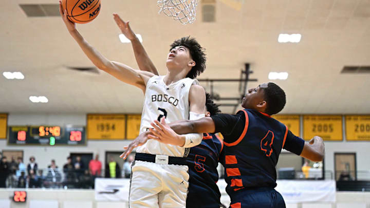 St. John Bosco's Chris Komin attacks the basket against Eastvale Roosevelt in the 2024 Classic at Damien.
