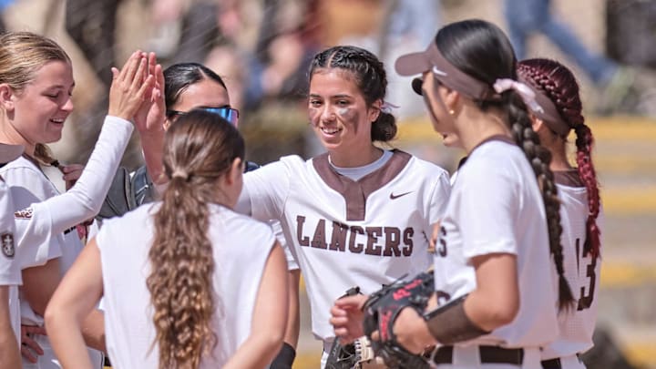 St. Francis softball players celebrate during a game against Cathedral Catholic.