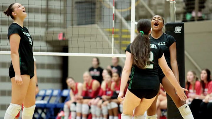 Three Southlake Dragons players celebrate a point during a match against Tomball on Nov. 15 Three Southlake Dragons players celebrate a point during a match against Tomball on Nov. 15