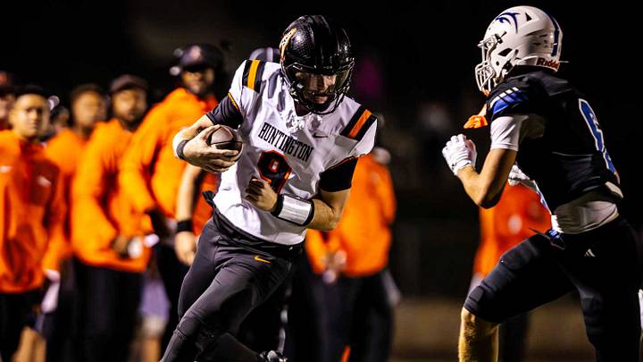 Huntington Beach's Brady Edmunds braces for a hit against Dana Hills. Huntington Beach's Brady Edmunds braces for a hit against Dana Hills.