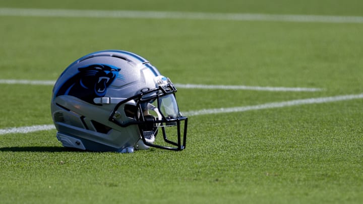 Jul 23, 2025; Charlotte, NC, USA; A Carolina Panthers helmet sits on the ground at training camp.