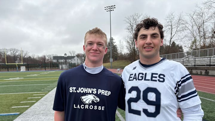 Two of St. Johns Prep players step in after the game to celeberate a victory