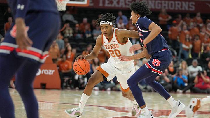 Texas Longhorns guard Tre Johnson (20) drives the ball against Auburn Tigers guard Chad Baker-Mazara (10) in the second half of an NCAA College Basketball game at Moody Center, Austin, Texas, Tuesday, Jan. 7, 2025.