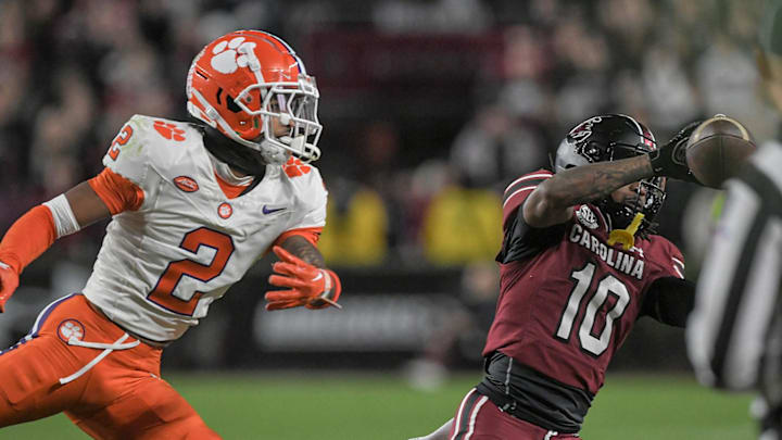 Nov 25, 2023; Columbia, South Carolina, USA; Clemson Tigers cornerback Nate Wiggins (2) battles for