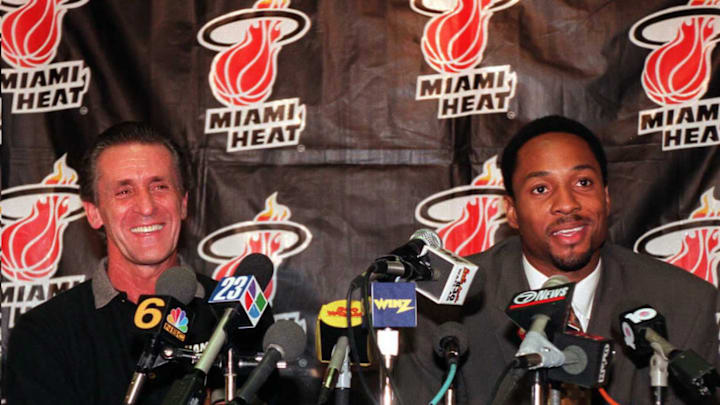 Head coach of the Miami Heat Pat Riley(L) sits wit